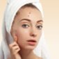 closeup young woman with towel head pimples face 85x85